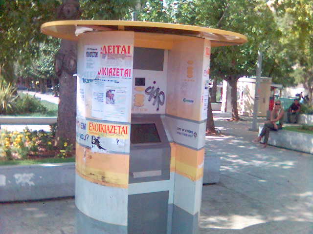 An information kiosk covered with grafiti
